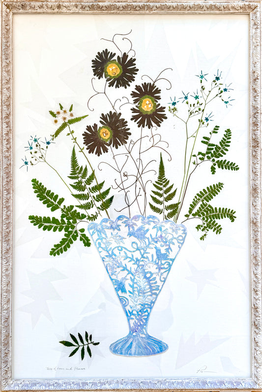 Vase of flowers and ferns